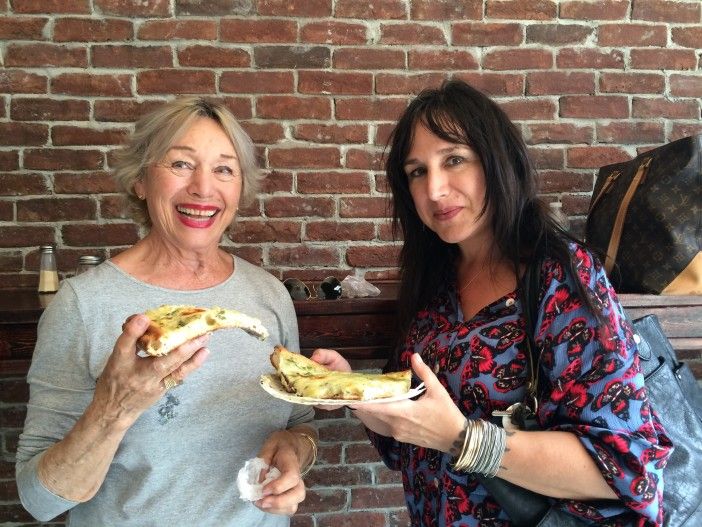 Laurette Vermey and Brigitte Prat sample artichoke pizza