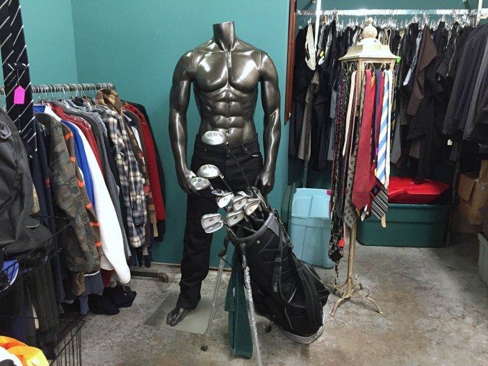 mannequin and golf clubs at a south slope thrift store