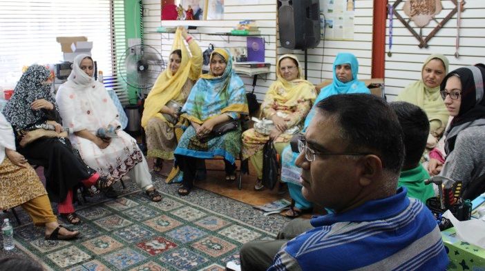 Shahid Khan discusses things the women can do to try to reinstate funding. (Photo by Shannon Geis/Ditmas Park Corner)