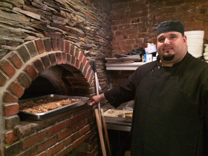 Chef Angelo Loukas cooking up roast pork