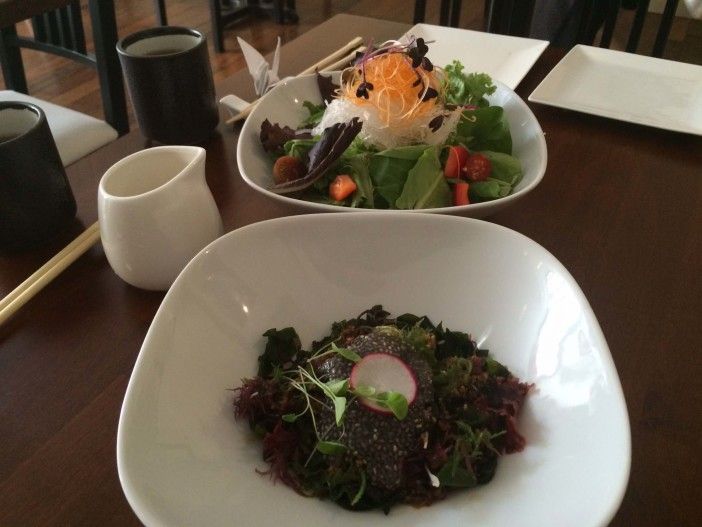 Seaweed salad with chia seeds (foreground) and Mixed Greens salad