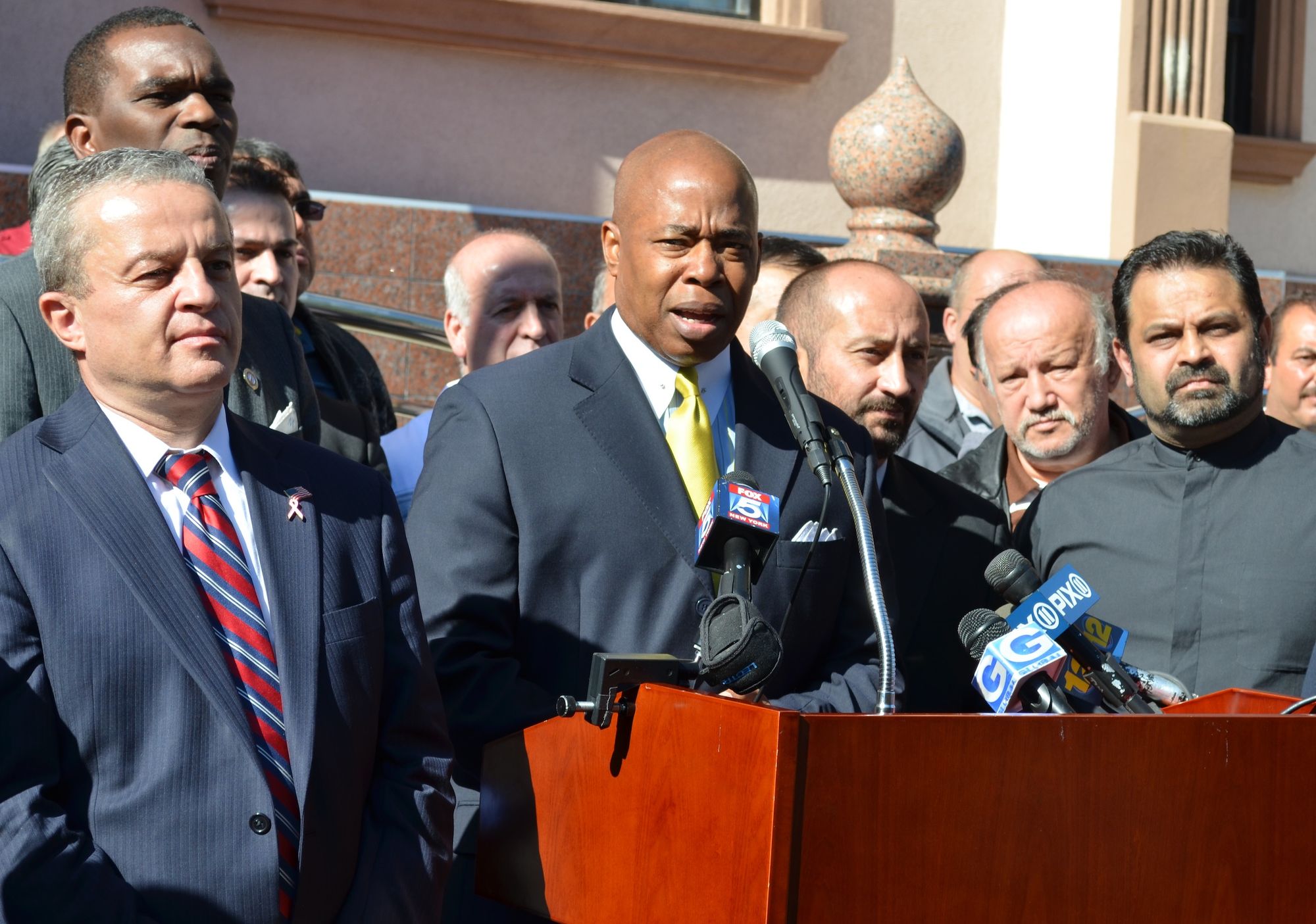 Borough President Eric Adams speaking outside the Turkish American Eyüp Sultan Cultural Center.