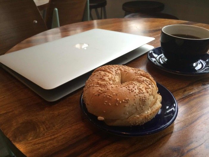 Coffee, bagel, and laptop at Elk Cafe