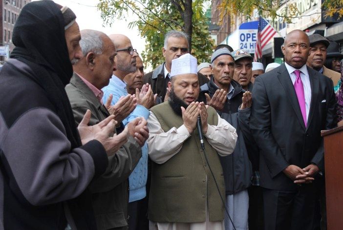 A local imam prays for the victims of the recent earthquake in South Asia. (Photo by Shannon Geis / Ditmas Park Corner)