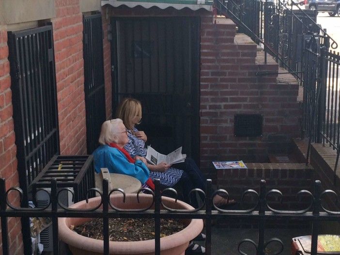 Ladies having a quiet moment on 4th Ave.