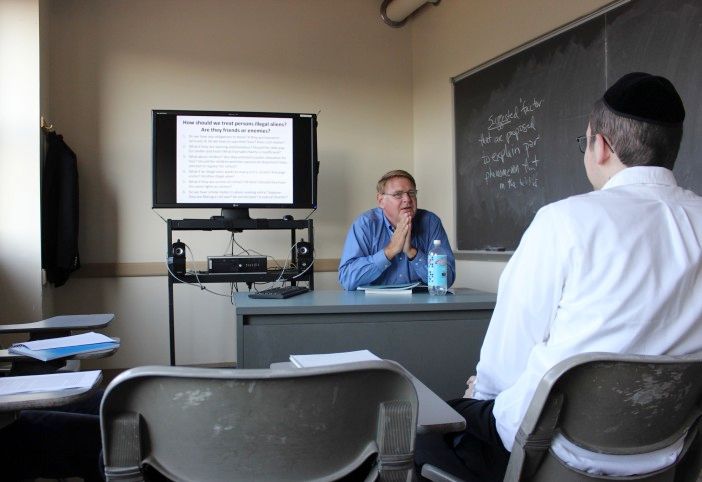 Professor Tom Rozinski teaching political theory at Touro College. (Photo by Shannon Geis/Ditmas Park Corner)