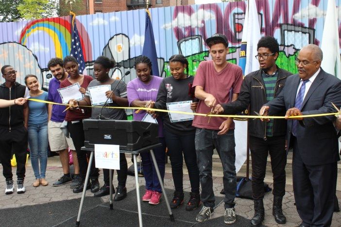 Cutting the ribbon on the Umma Park mural. (Photo by Shannon Geis/Ditmas Park Corner)