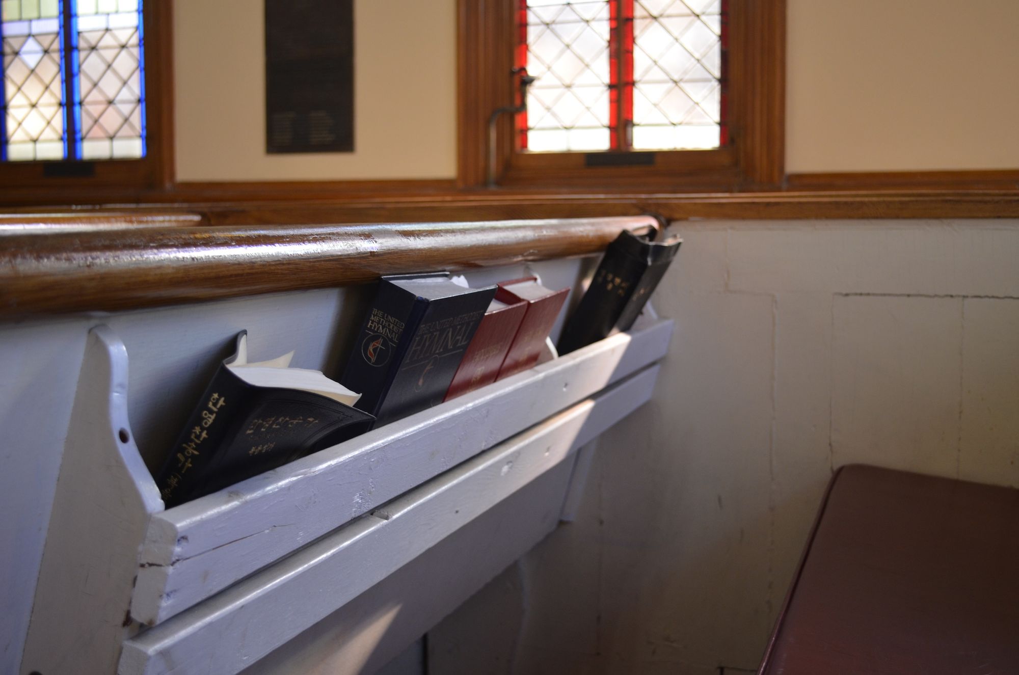 Bibles tucked behind a pew at the United Methodist Church of Sheepshead Bay.