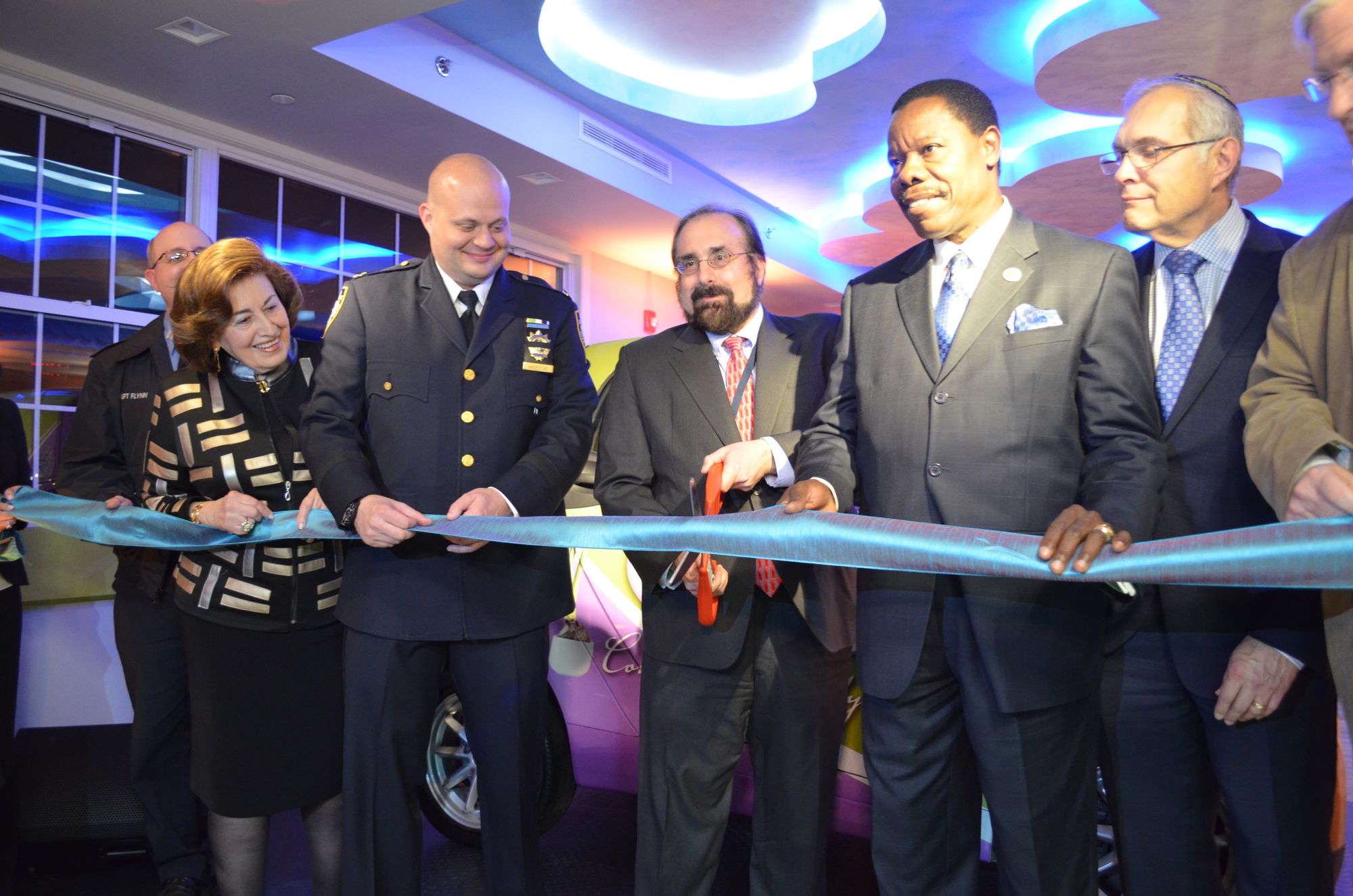 John Maese of Coney Island Hospital about to cut the ribbon. 