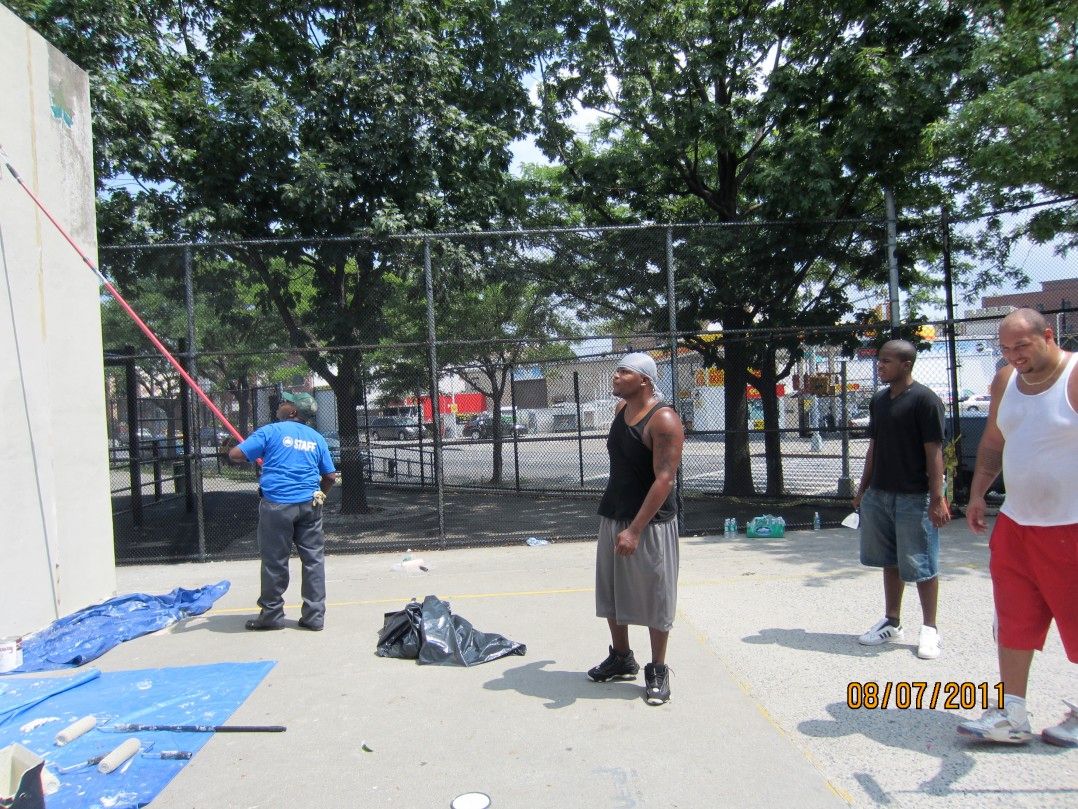 Parksworker and basketball players painting Handball court wall at Aug.2011 "IT'S MUY PARK DAY>"