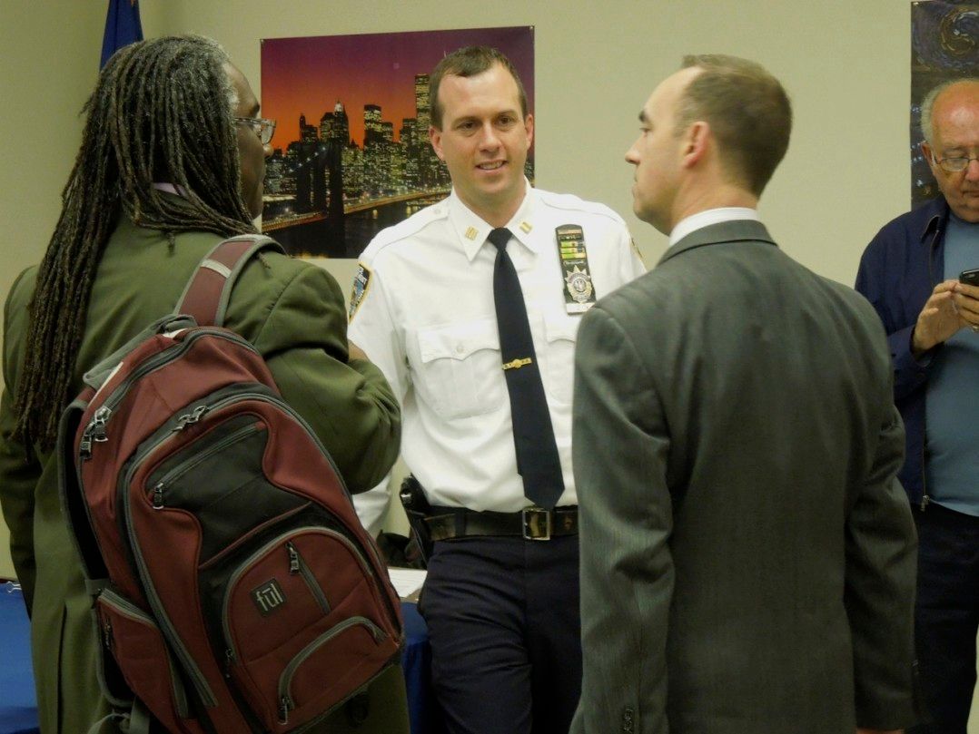 Capt. Quick , whtie shirt, talking with Brooklyn DAs.