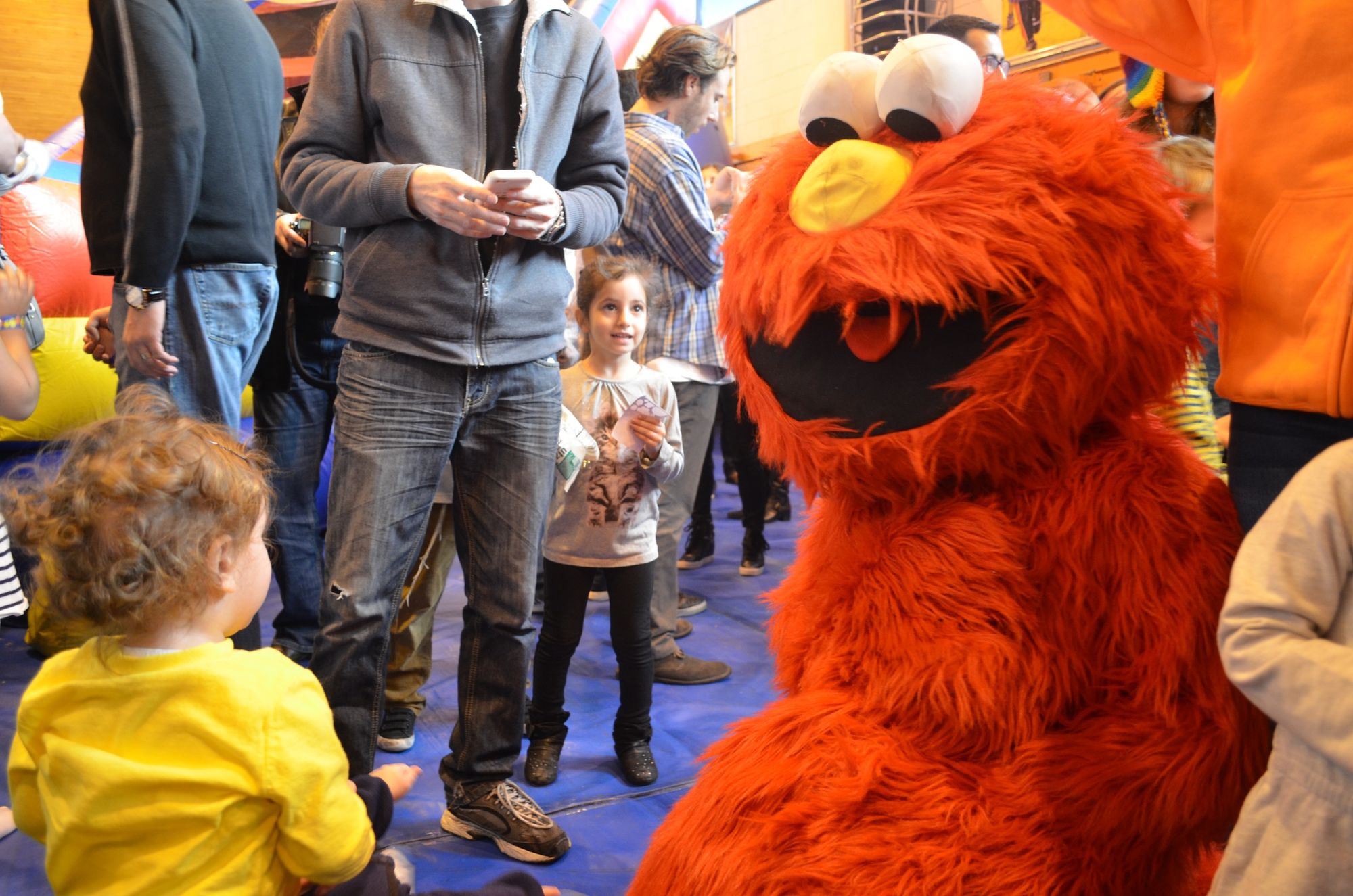 A costumed Elmo brings joy to the kids. 