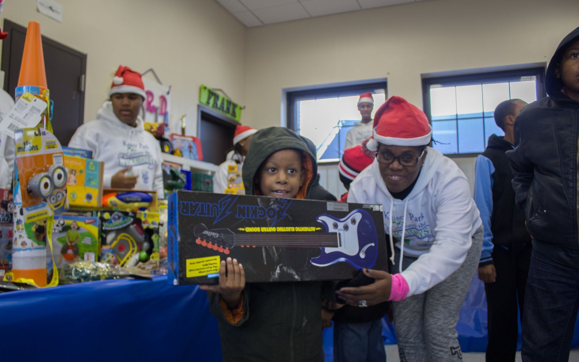 A child poses with a new toy at Saturday's event.