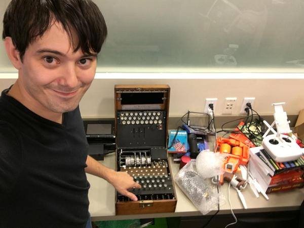 Hedge fund manager Martin Shkreli posing with an Enigma machine, used by the Nazis to decode communications.