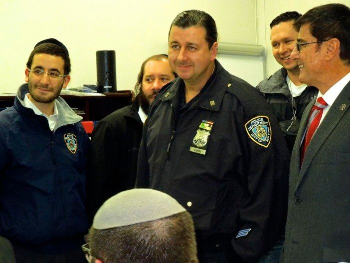 Members of the 66th Precinct and the Shomrim at December's Community Council meeting. (Photo by Jole Carliner/Ditmas Park Corner)