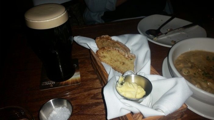 Homemade Irish soda bread with butter, salt, and a glass of Guinness. (Photo by Heather Chin/Fort Greene Focus)