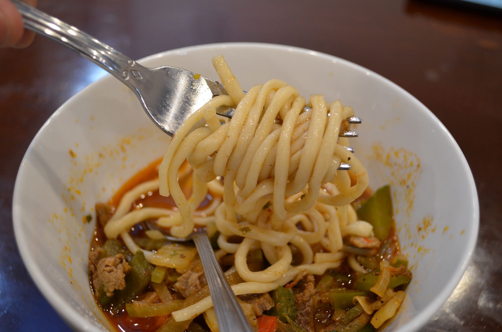 Hand-pulled noodles in the lagman soup. (Photo: Alex Ellefson / Sheepshead Bites)