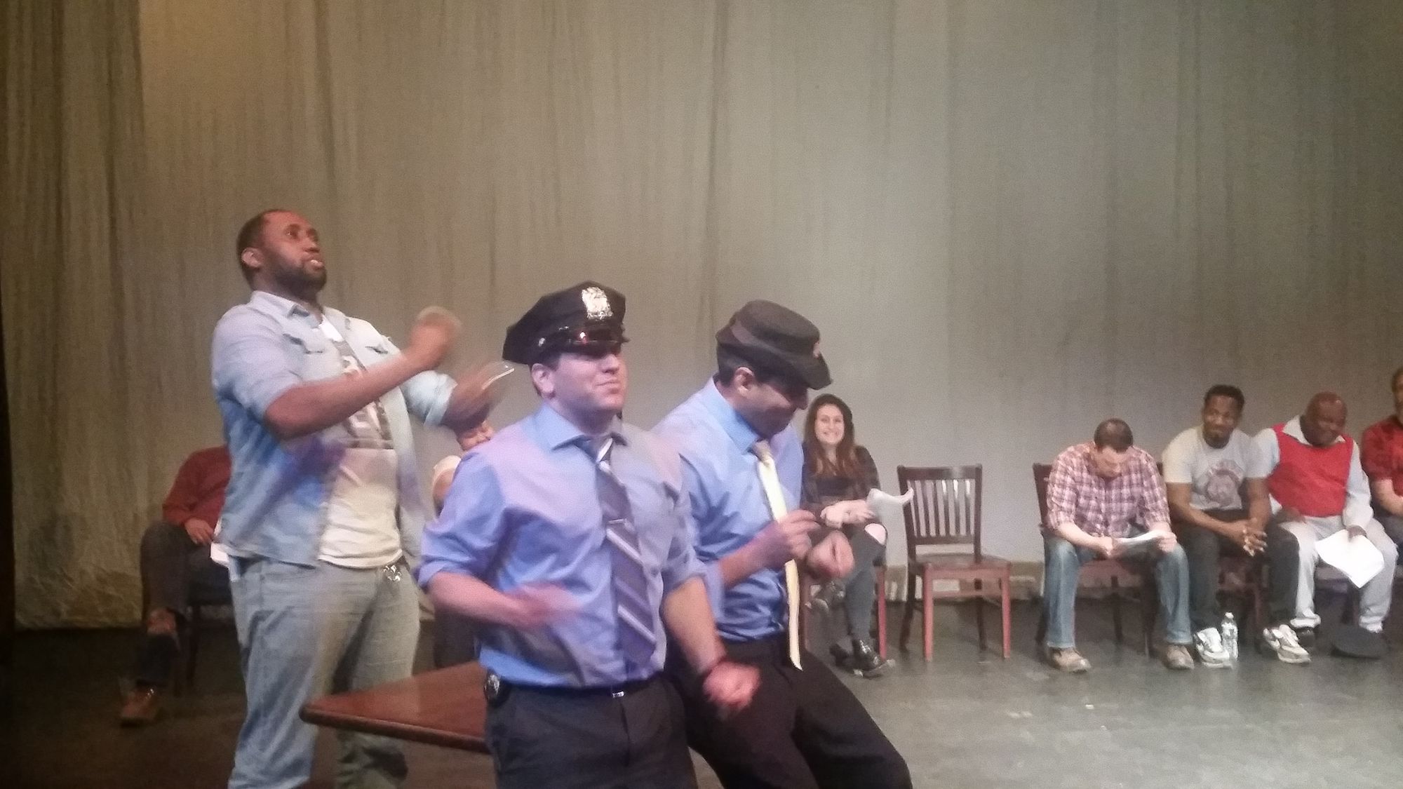 Police Officers Stephen Barnes, Guy Randel, and Jaime Ramirez rehearsing a skit. (Photo by Heather Chin/Fort Greene Focus)