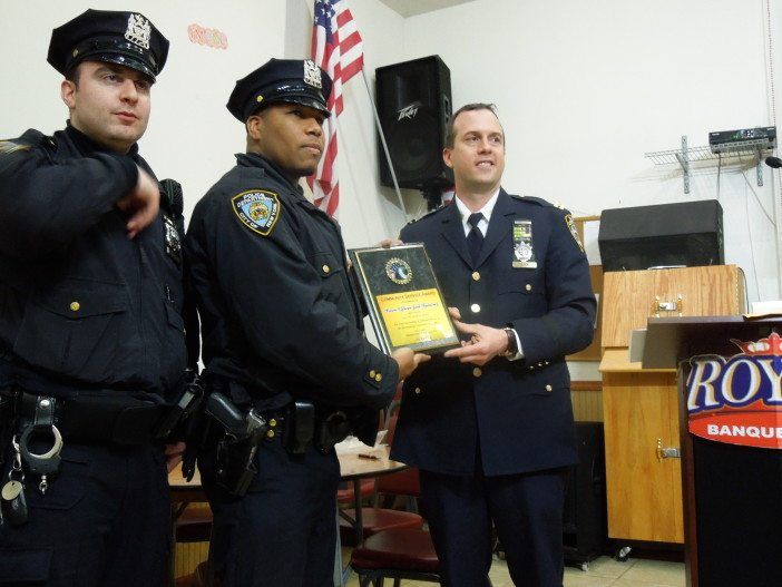 Officer Alter, and February Cop of the Month Officer Joel Ramirez, with Capt. Quick. 