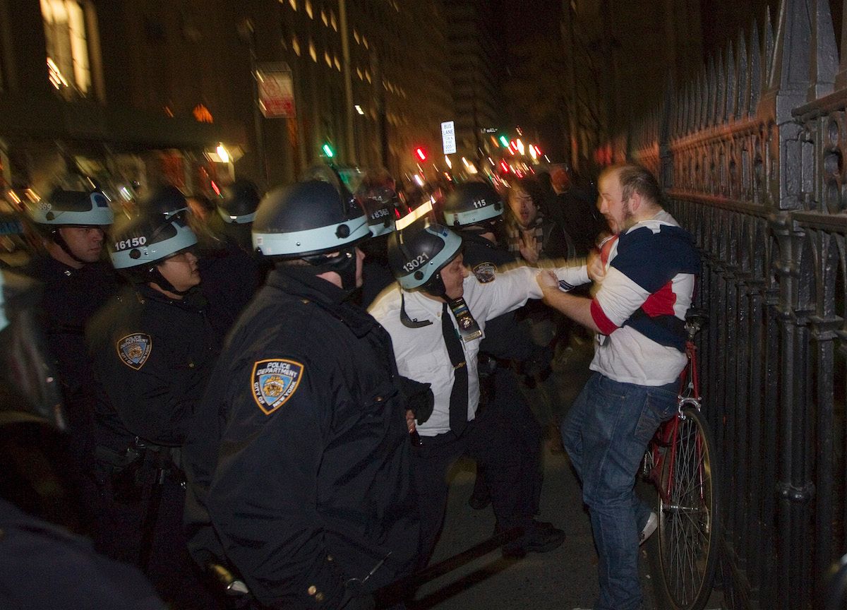 NYPD Lieutenant Joseph Hayward prepares to strike Brent Schmidt at Zuccotti Park on November 15, 2011. (Photo: REUTERS/Lucas Jackson)