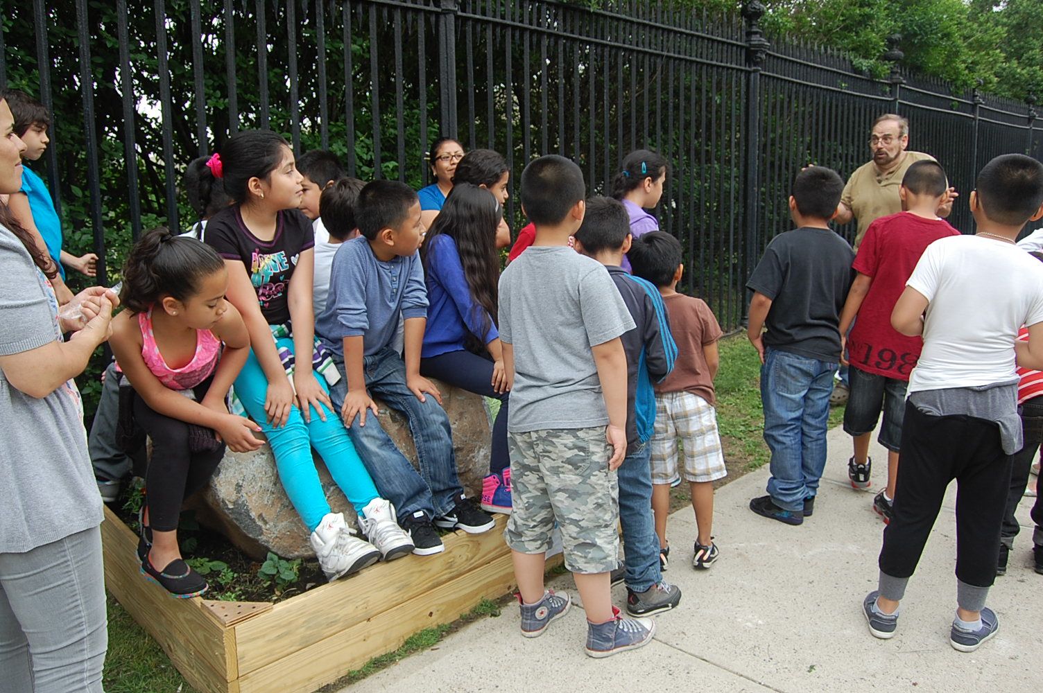 PS 24 students learning about the Legend of Martense Lane at the boulder. (Photo courtesy of Tony Giordano)