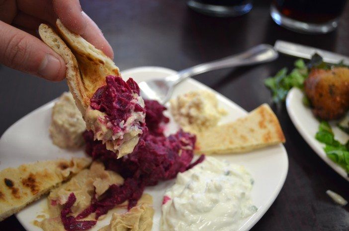 Hummus and beet salad on pita bread at Lotus Cafe. (Photo: Alex Ellefson / Sheepshead Bites)