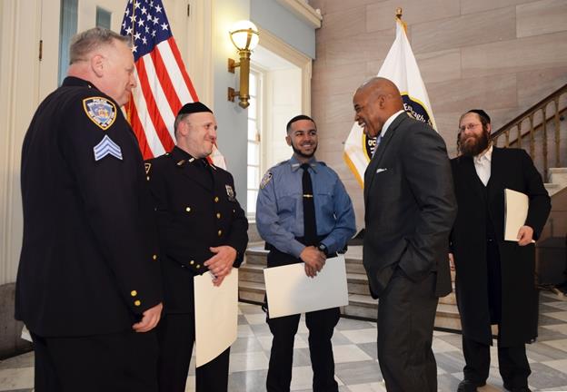 From left to right: Sergeant Frederick Manney, Officer Nuchem Schwartz, Cadet Elijah Satos. Shloime Kohn of Williamsburg is on the far right. (Photo: Erica Sherman / Brooklyn BP’s Office)