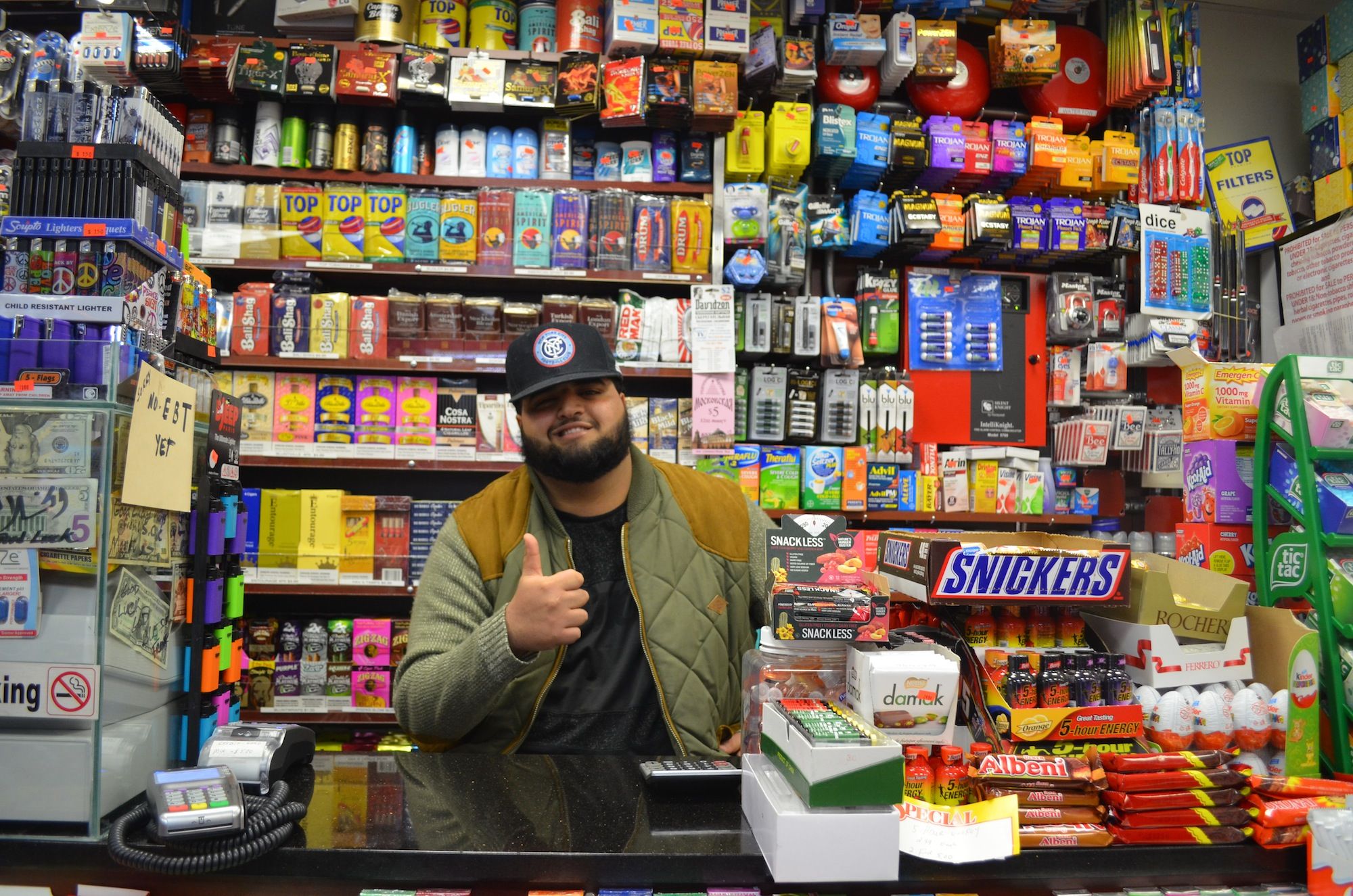 Malik Almardie mans the counter at the new deli on Sheepshead Bay Road. (Photo: Alex Ellefson / Sheepshead Bites)