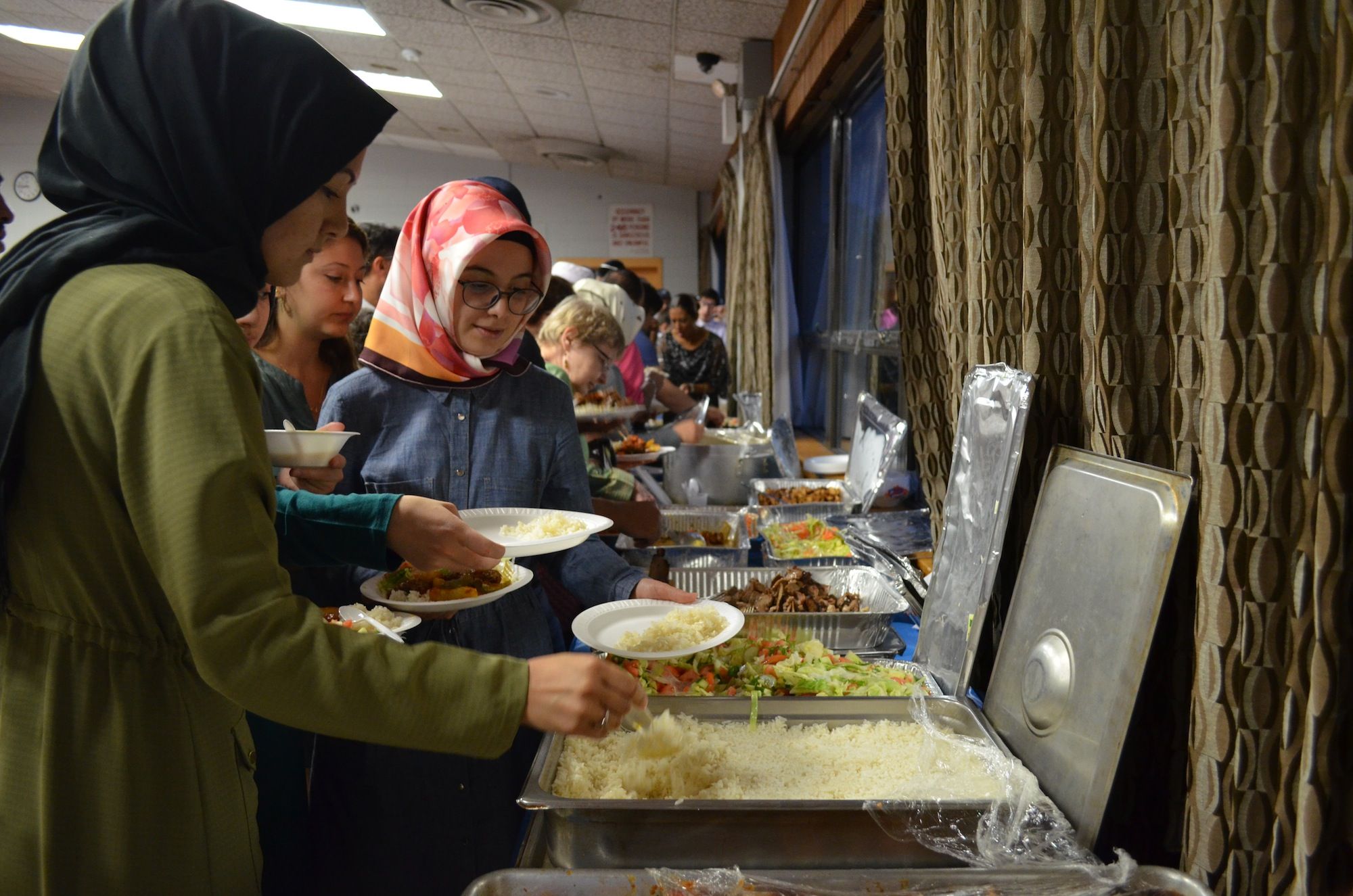 Breaking the daylong fast at the Kings Bay Y's Ramadan dinner. (Photo: Alex Ellefson / Sheepshead Bites)