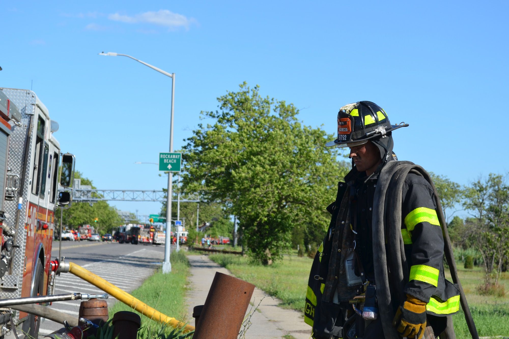 A firefighter walking onto Flatbush Avenue after battling the flames. (Photo: Alex Ellefson / Sheepshead Bites)