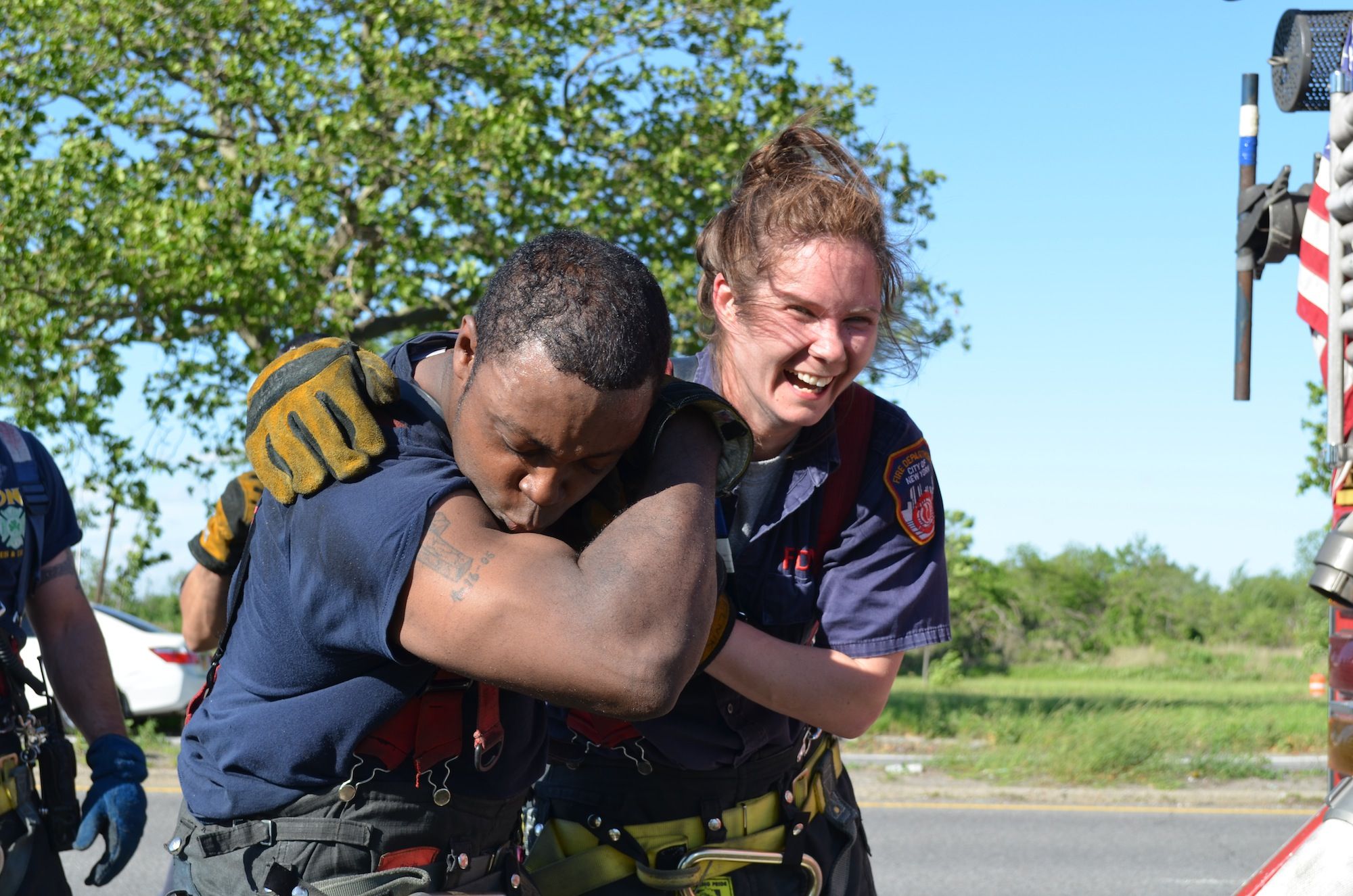 Firefighters celebrate finishing off a brush fire in Marine Park and Plumb Beach. (Photo: Alex Ellefson / Sheepshead Bites)