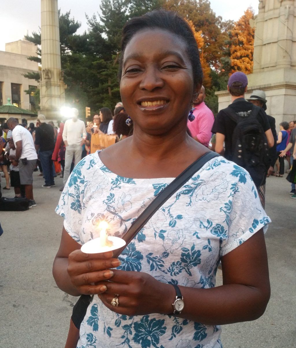 JoAnne Howell of Boerum Hill holds a candle during the vigil. (Elizabeth Elizalde / Sunset Park Voice) 