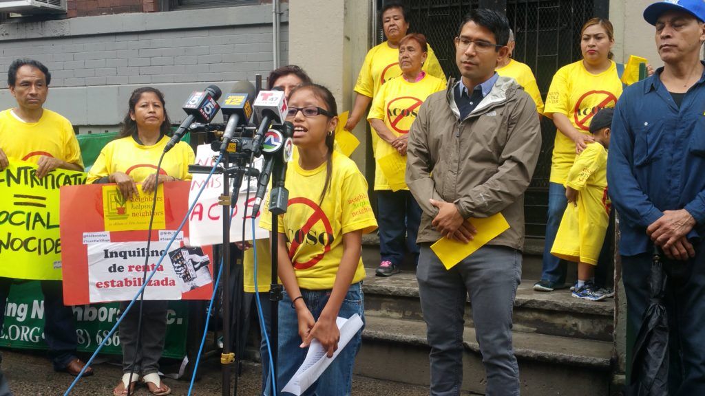 Samantha Bravo speaking to reporters in front of her home in Sunset Park. (Photo: Elizabeth Elizalde / Sunset Park Voice)