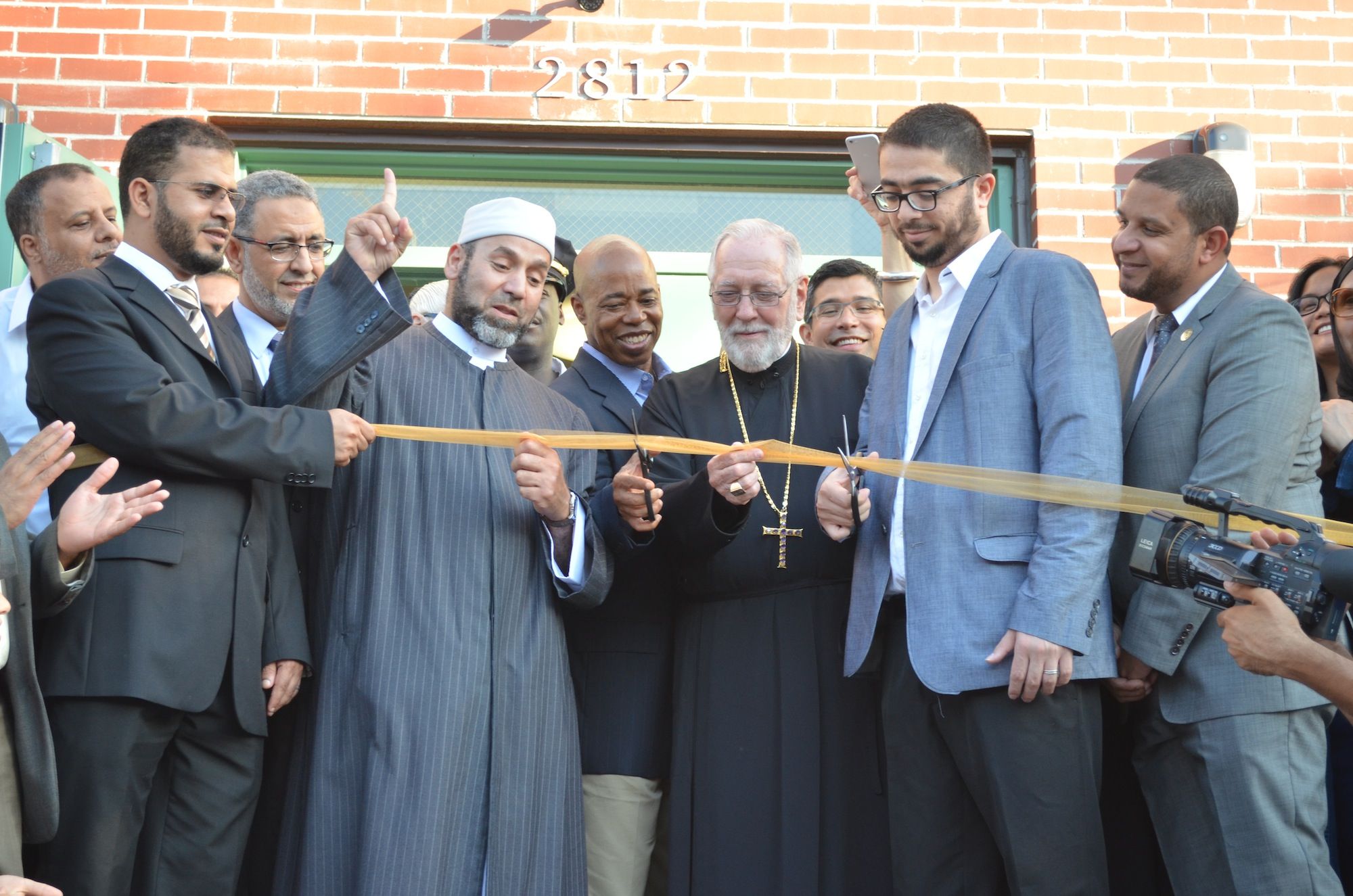 Cutting the ribbon outside the MAS Sheepshead Bay Community Center at 2812 Voorhies Avenue. (Photo: Alex Ellefson / Sheepshead Bites)