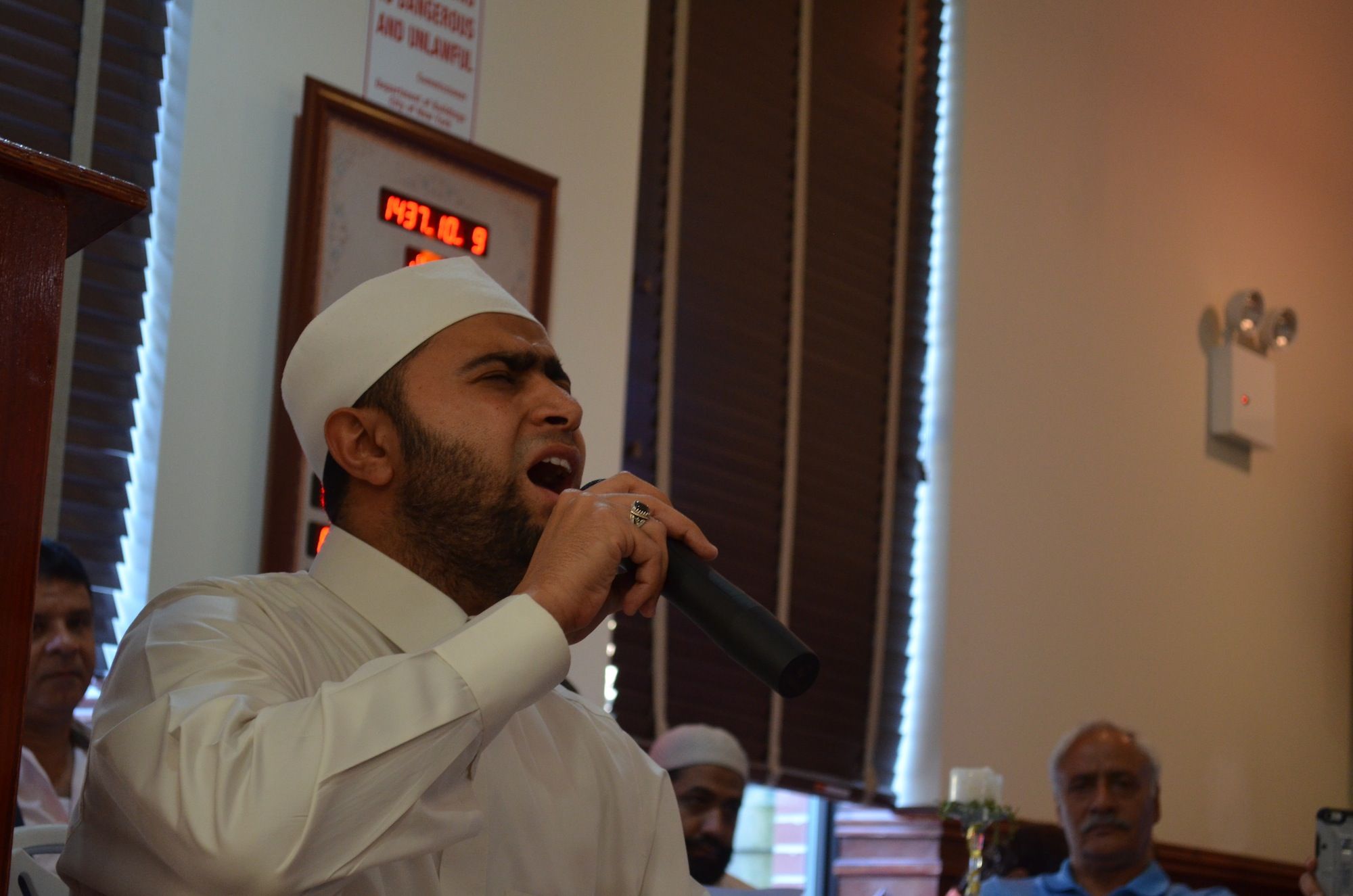 Sheik Ahmed Tahoon leading a prayer in the mosque. (Photo: Alex Ellefson / Sheepshead Bites)