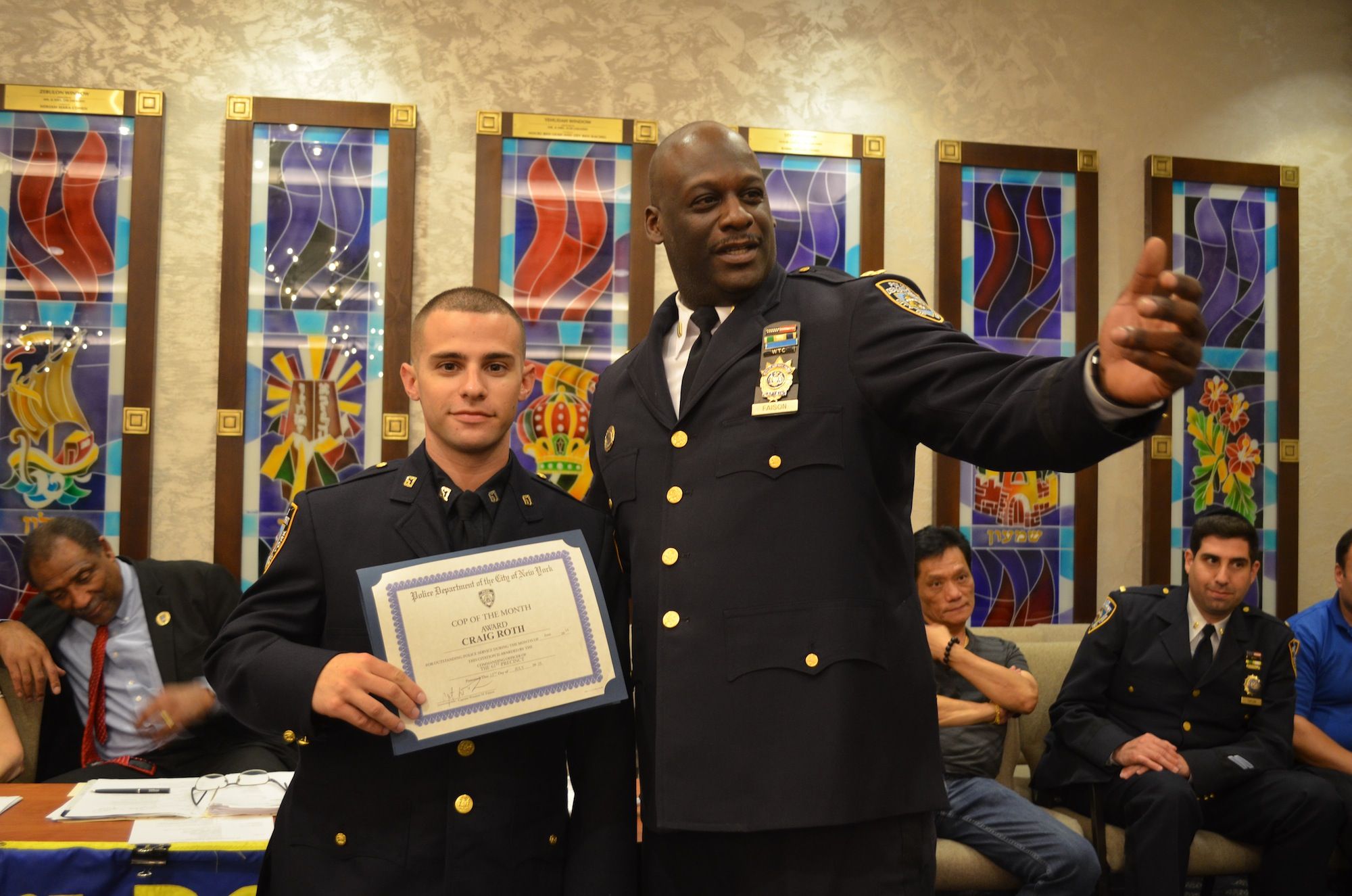 Officer Craig Roth (left) receiving the Cop of the Month award from Captain Winston Faison. (Photo: Alex Ellefson / Sheepshead Bites)