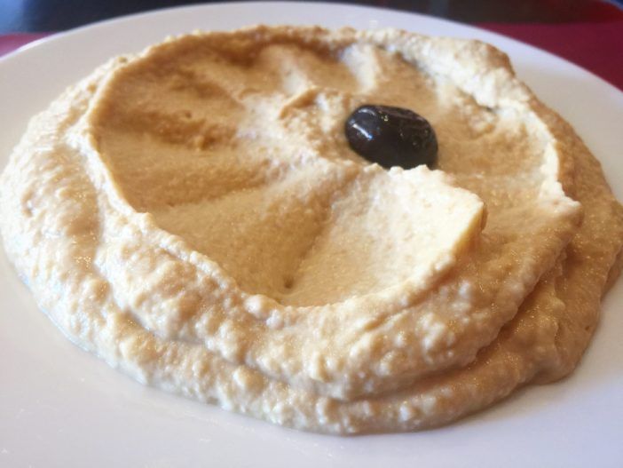 The mashed chickpea king adorned with its olive crown. (Courtesy Fort Greene Focus/Justin Fox)