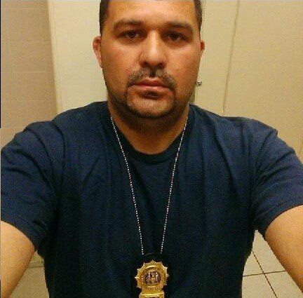 Jason Forgetta posing with fake badge on Facebook.