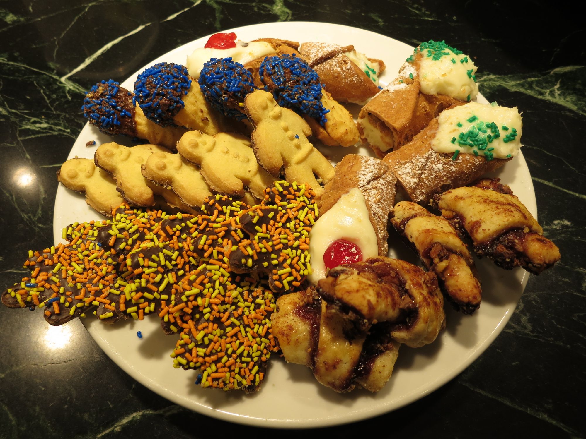 Nuccio's cookies and cannoli just prior to consumption. The rugelach was from a different vendor, but was included on the plate for aesthetic purposes