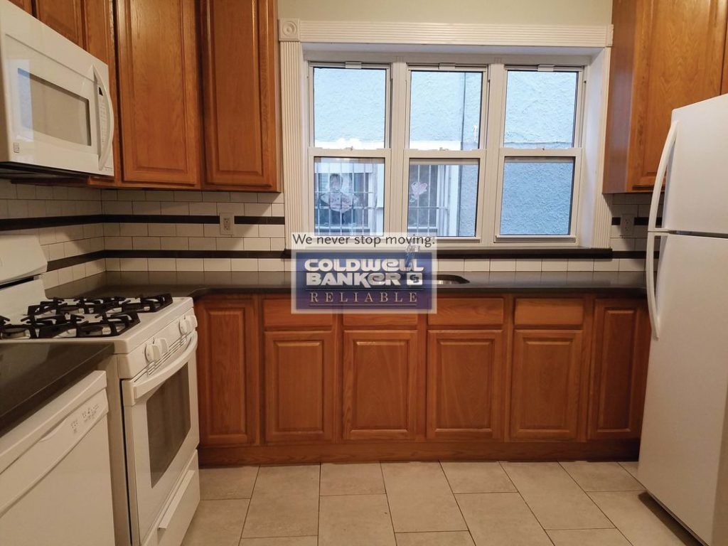 I thought this watermark was a sticker. (Courtesy Street Easy/Juan J. Martes of Coldwell Banker Reliable)