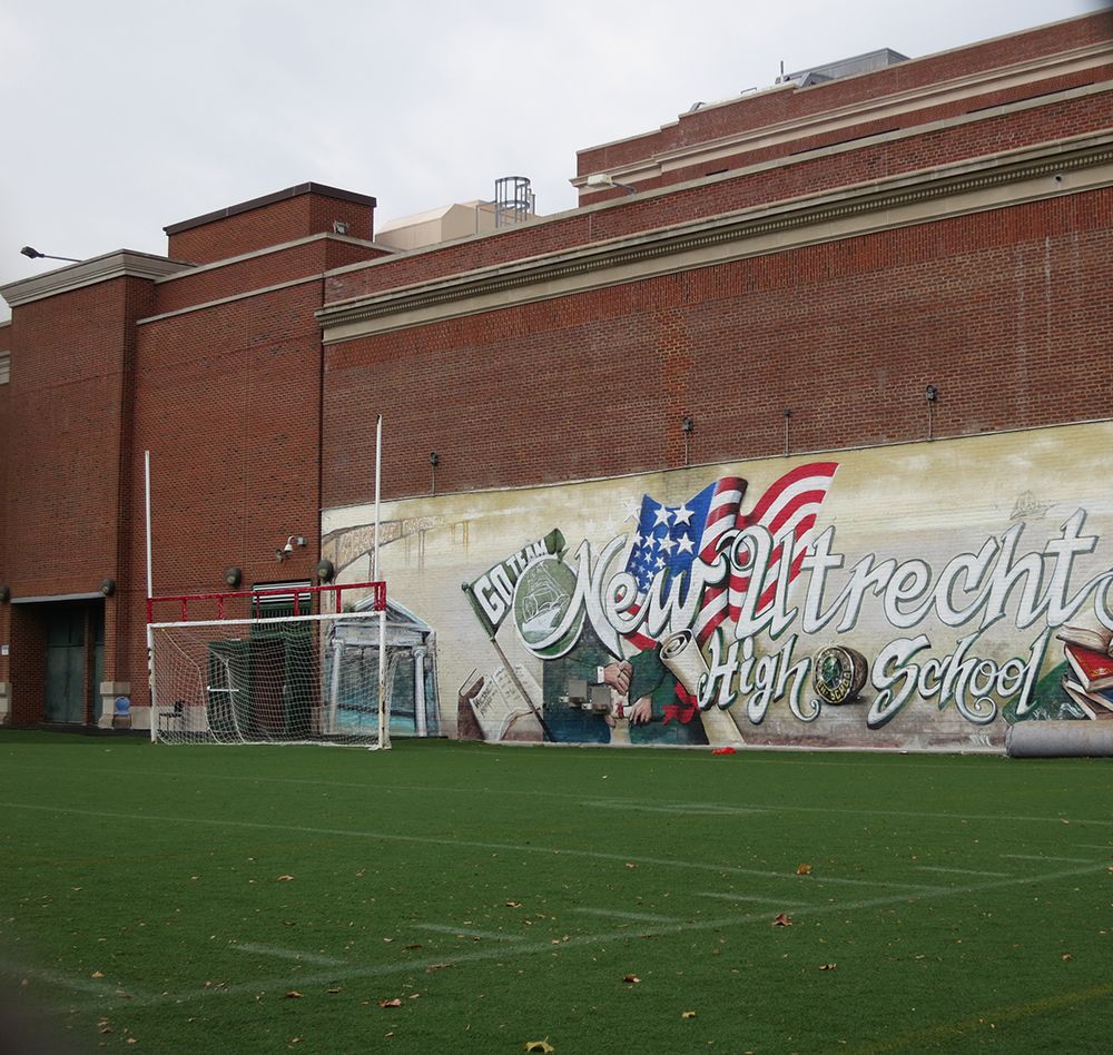 The New Utrecht High School sports field and a mural. Photo by Hannah Frishberg