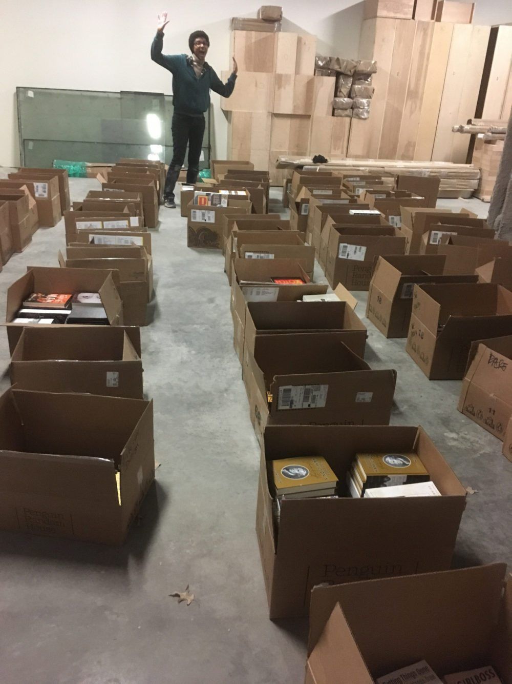 Staffer Soraya surfing the wave of books. (Photo via Greenlight PLG Tumblr)