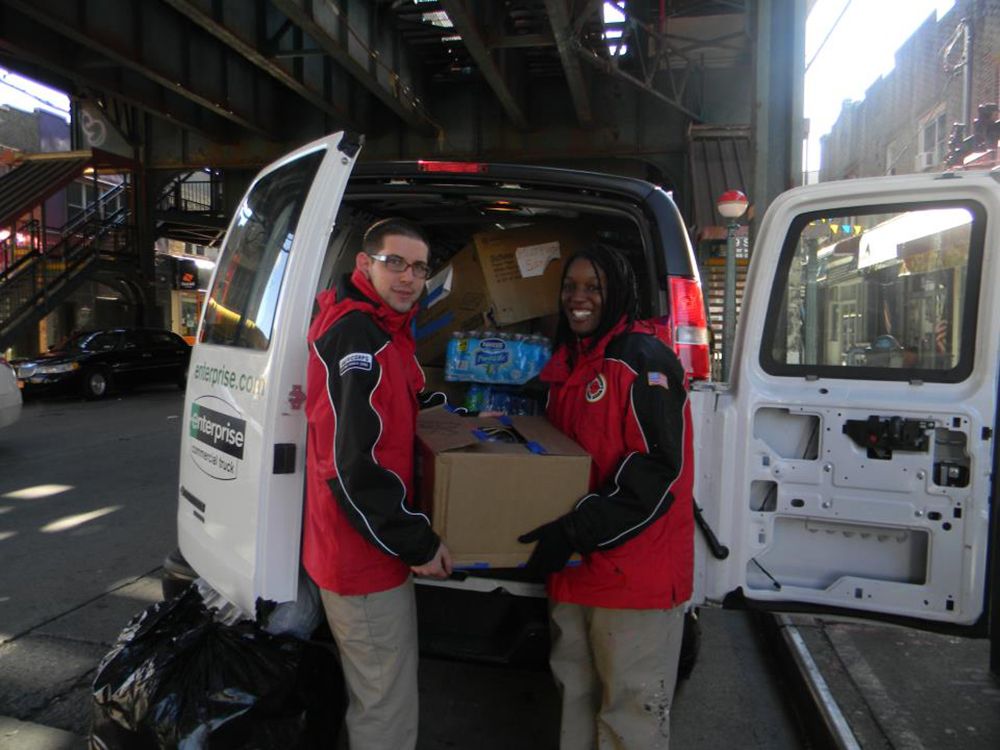 The organization City Year with a van full of food for needy neighbors. Photo via RCS-Reaching Out Community Services' Facebook 