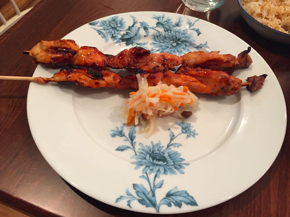 Chicken skewers and pickled papaya.