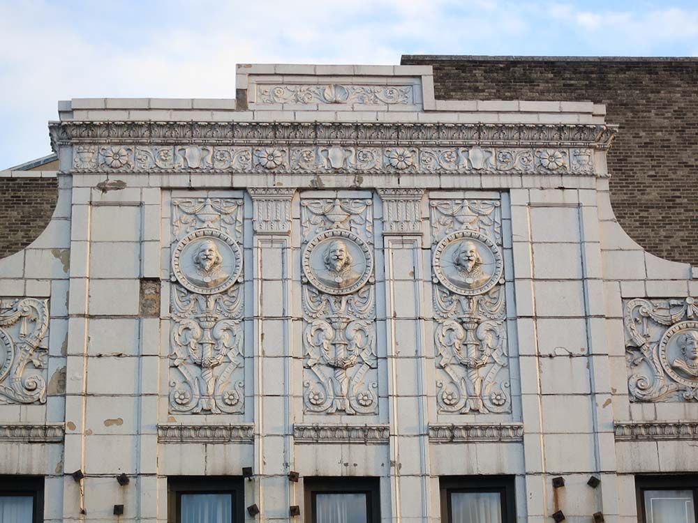 Remnants of the building's theater past are still visible on its gorgeously detailed facade. (Photo by Hannah Frishberg / Bensonhurst Bean)