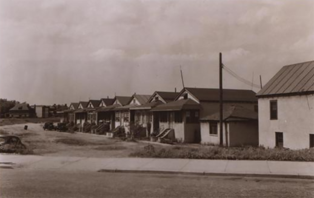 Emmons Avenue between East 29th Street and Nostrand Avenue, 1940. "Shown is a row of bungalows, which appear on Hyde's 1929 map as Nos. 1 to 15 Cantor Avenue, the latter evidently being the stretch of low land in front of the dwellings. (Photo by L. Sperr. Photo via NYPL)