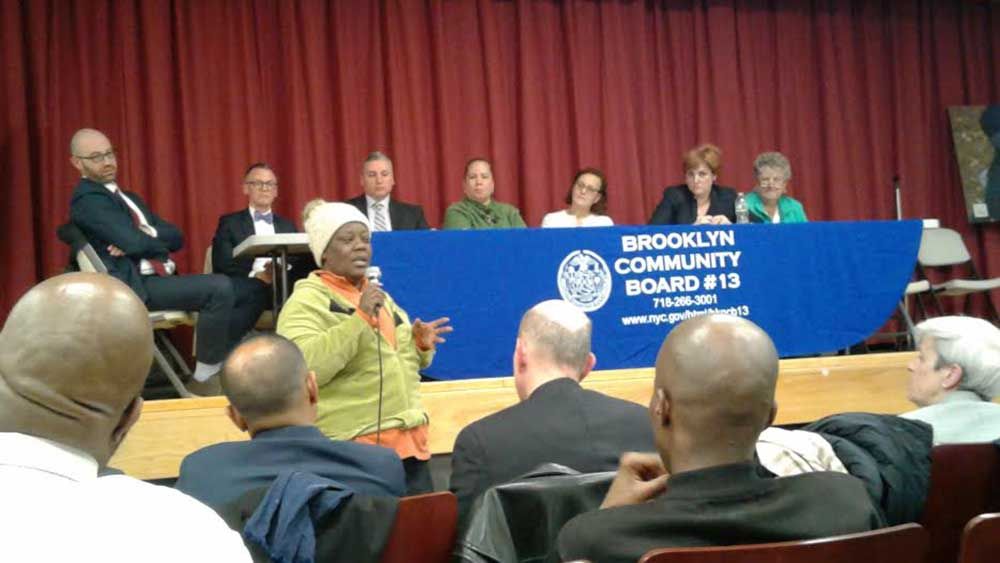 A community member tells a panel of her proposed shelter plan concerns Thursday night at P.S. 329 on Coney Island. (Photo by Jerry Del Priore / Bensonhurst Bean)